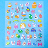 Sheet of Easter-themed  glitter nail art stickers with eggs, bunnies, and flowers on a blue background.
