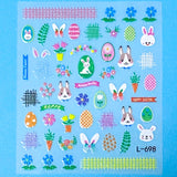 Sheet of Easter-themed glitter nail art stickers with bunnies, eggs, and flowers on a blue background.