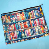 storybook bookshelf pencil case with colourful books and floral design on a blue background