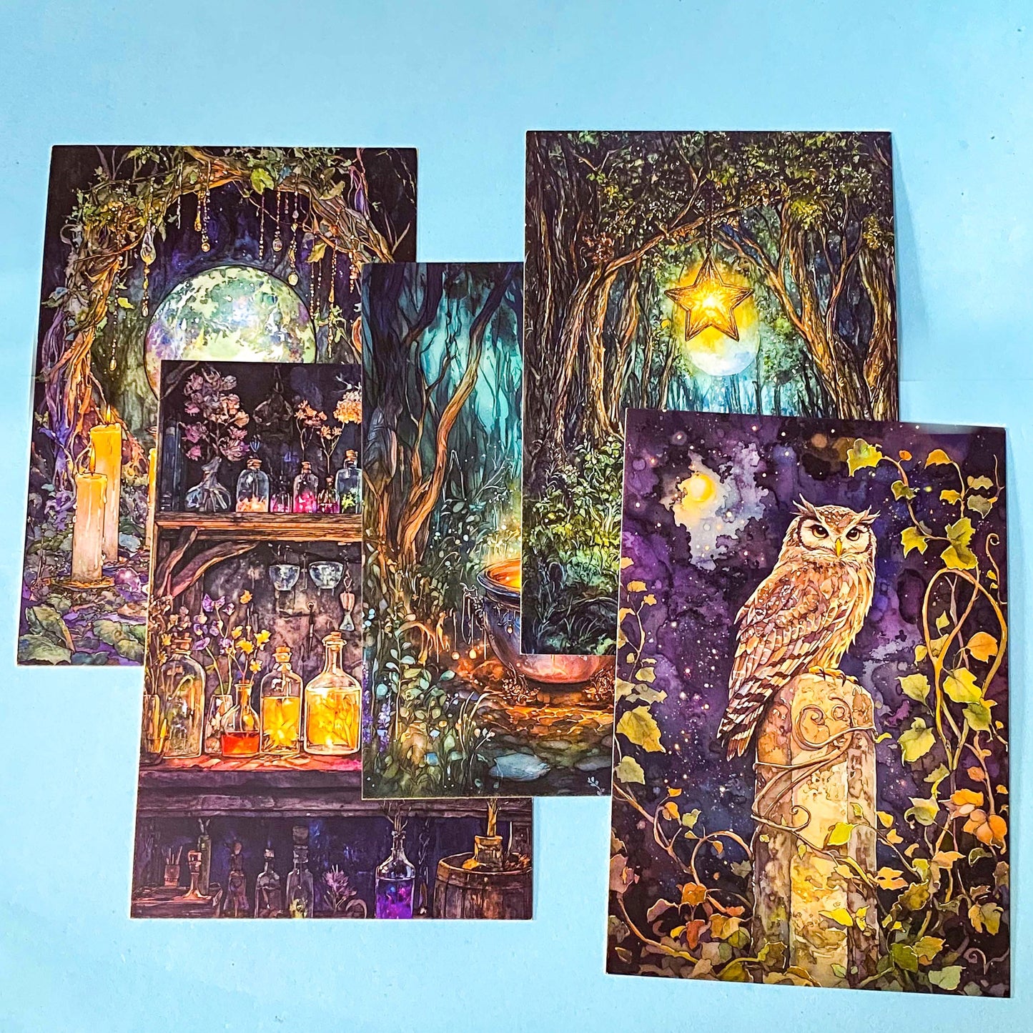 moon witch gift set with illustrated pouch, magical postcards, holographic stickers and celestial bookmark on blue background
