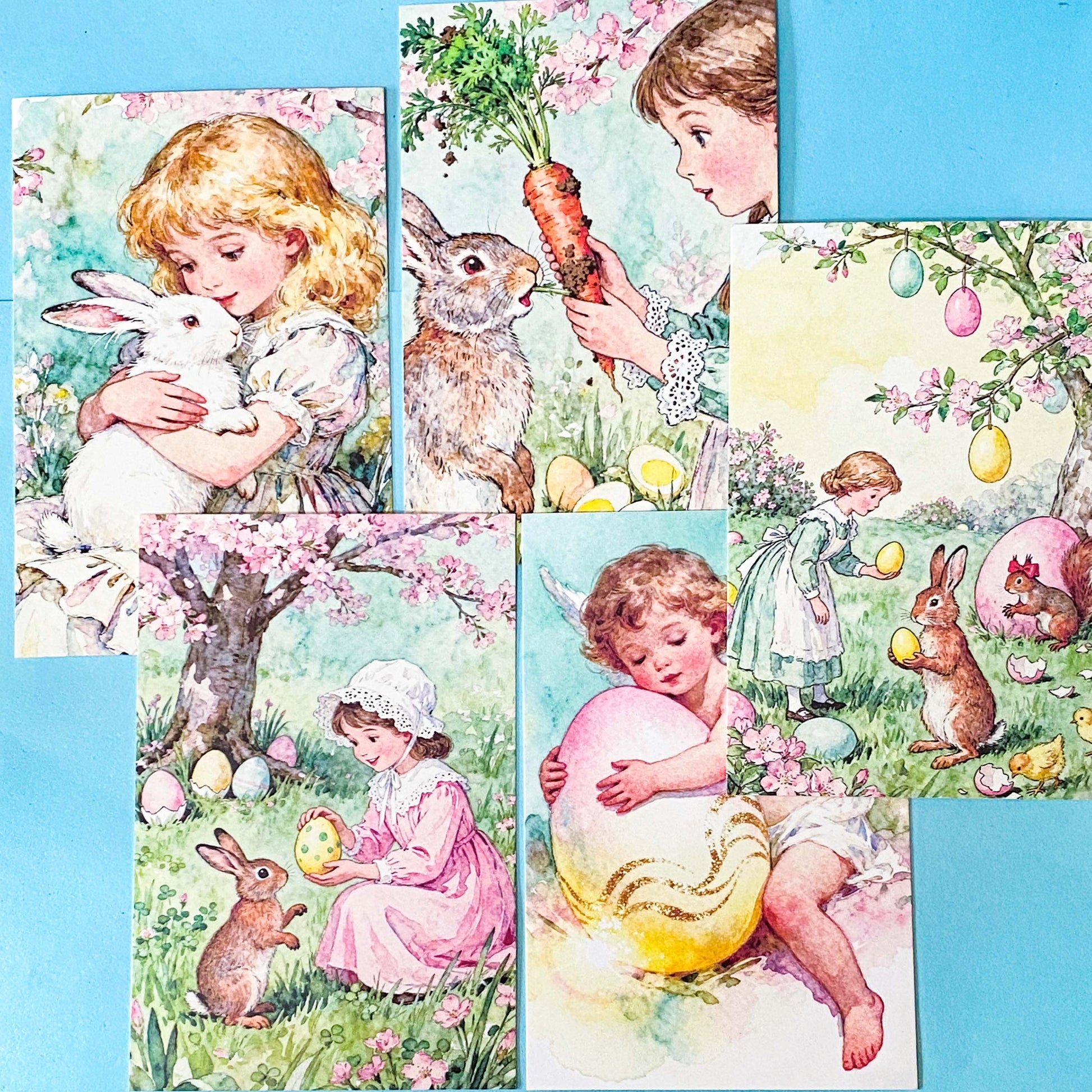 vintage storybook postcard set of 5 featuring a girl with rabbits and pastel eggs in a spring garden on a blue background