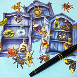 nature themed magic cabinet ephemera set with blue illustrated cabinet shelves and 22 paper cut put pieces including moths, insects and specimen bottles on a blue background with a pen