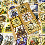 glossy witchy cat stickers spread out showing magical designs including potion cats, astrology, spell books and crystal ball illustrations in vintage style
