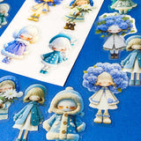 blue themed large PET doll stickers with kawaii illustrations including flowers, hydrangea, cosy winter outfits and turquoise dresses. Uk small business.