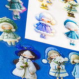 blue themed large PET doll stickers with kawaii illustrations including flowers, hydrangea, cosy winter outfits and turquoise dresses. Uk small business.