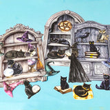 witch cabinet of curiosities ephemera pack with black cats, spell books, crystal balls and gothic shelves on blue background