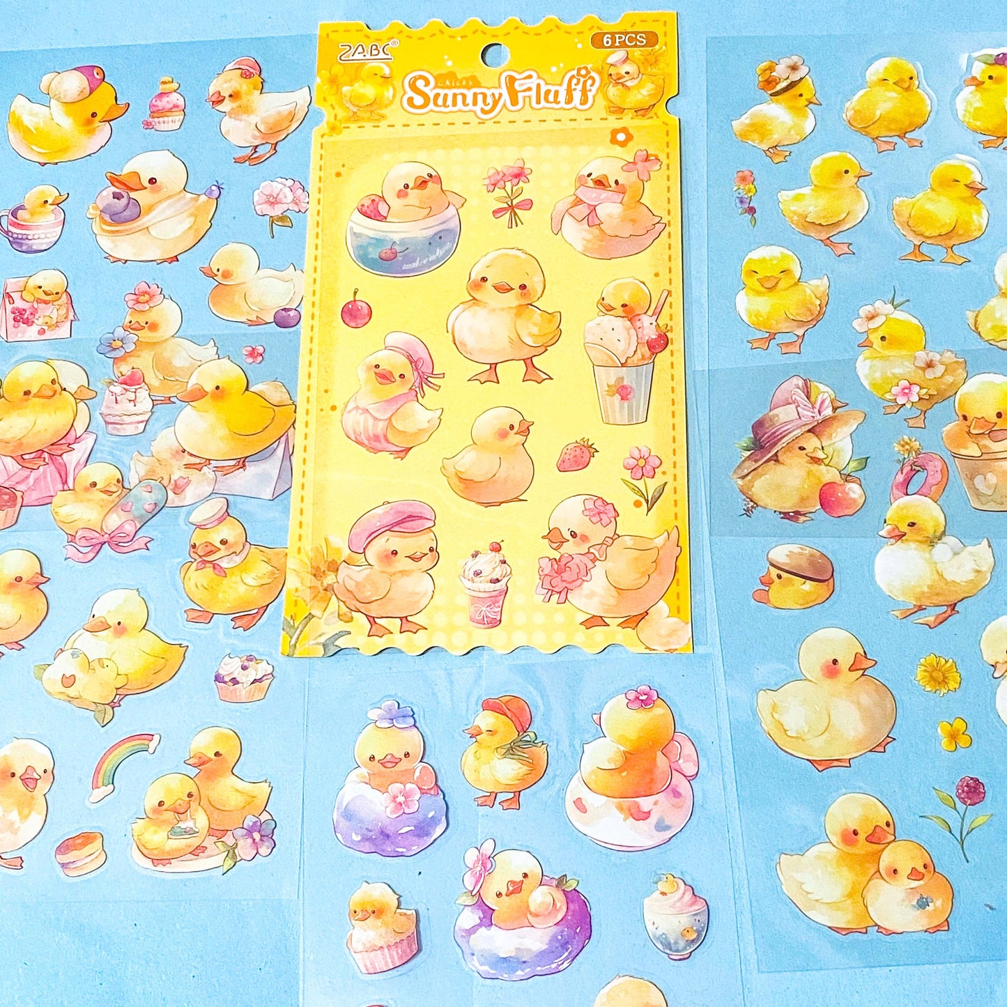 set of 6 clear kawaii chick sticker sheets with pastel yellow chicks, flowers, spring illustrations on transparent backing