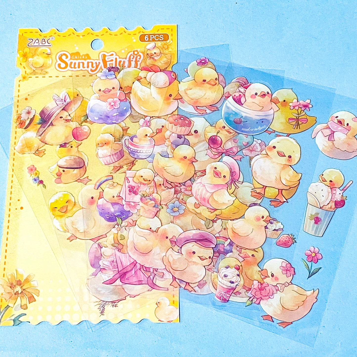 set of 6 clear kawaii chick sticker sheets with pastel yellow chicks, flowers, spring illustrations on transparent backing