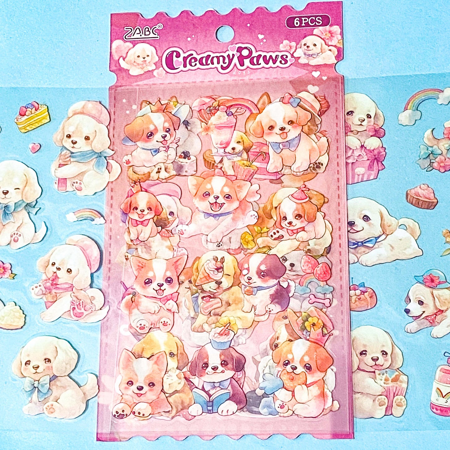 set of 6 kawaii puppy clear sticker sheets with pastel illustrations of cute dogs, desserts and accessories in a pink packet
