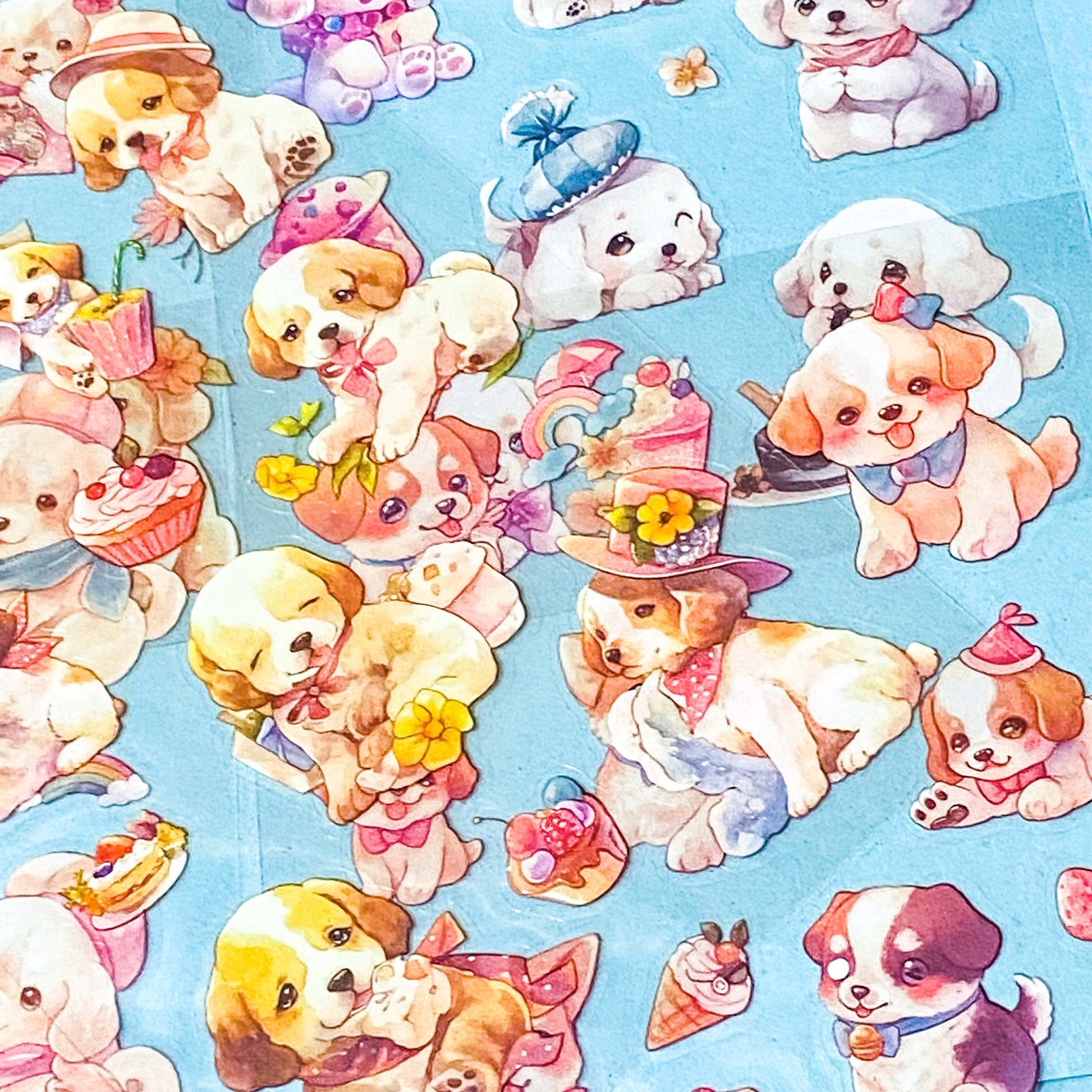 set of 6 kawaii puppy clear sticker sheets with pastel illustrations of cute dogs, desserts and accessories in a pink packet