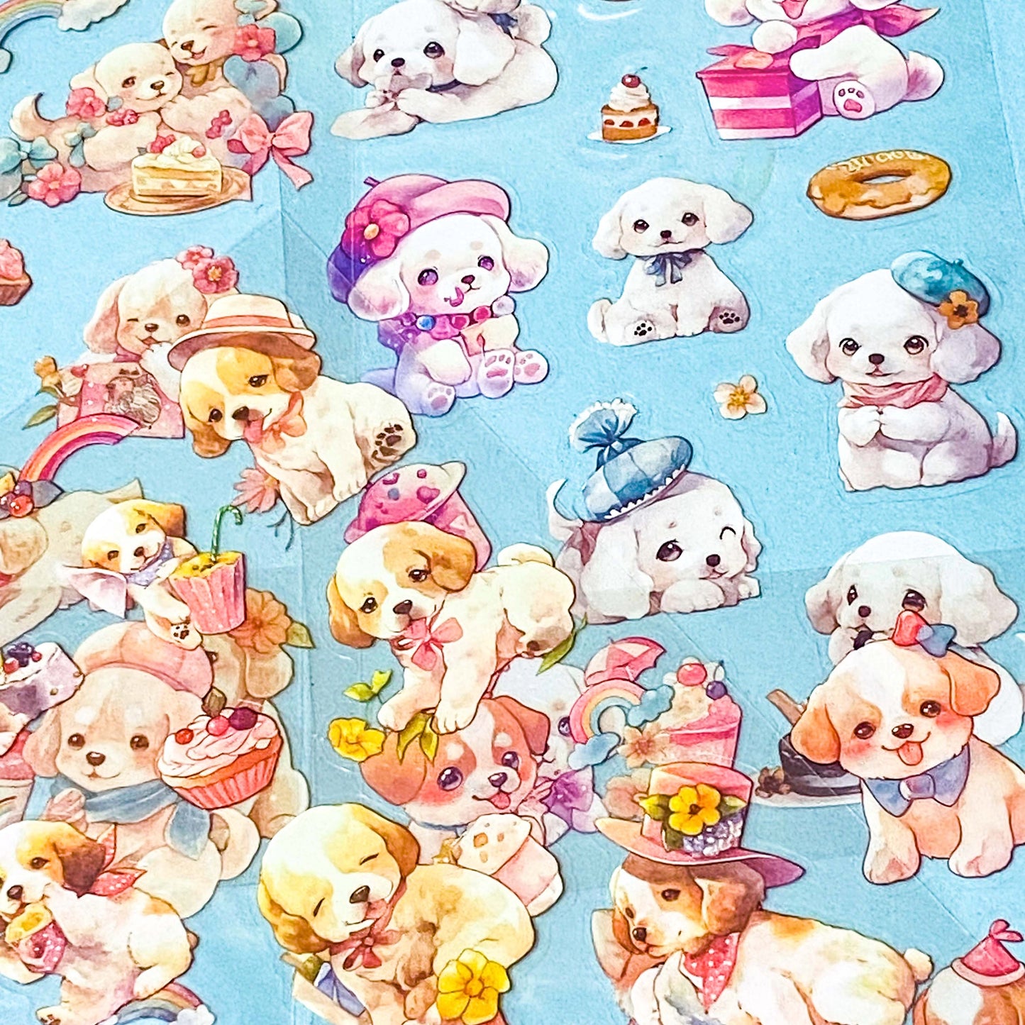 set of 6 kawaii puppy clear sticker sheets with pastel illustrations of cute dogs, desserts and accessories in a pink packet