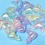iridescent winged heart acrylic beads on a blue background