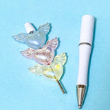white pen base with winged heart large acrylic beads on a blue background