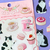 clear Sticker sheet with cats, coffee, and desserts on a pink and purple background