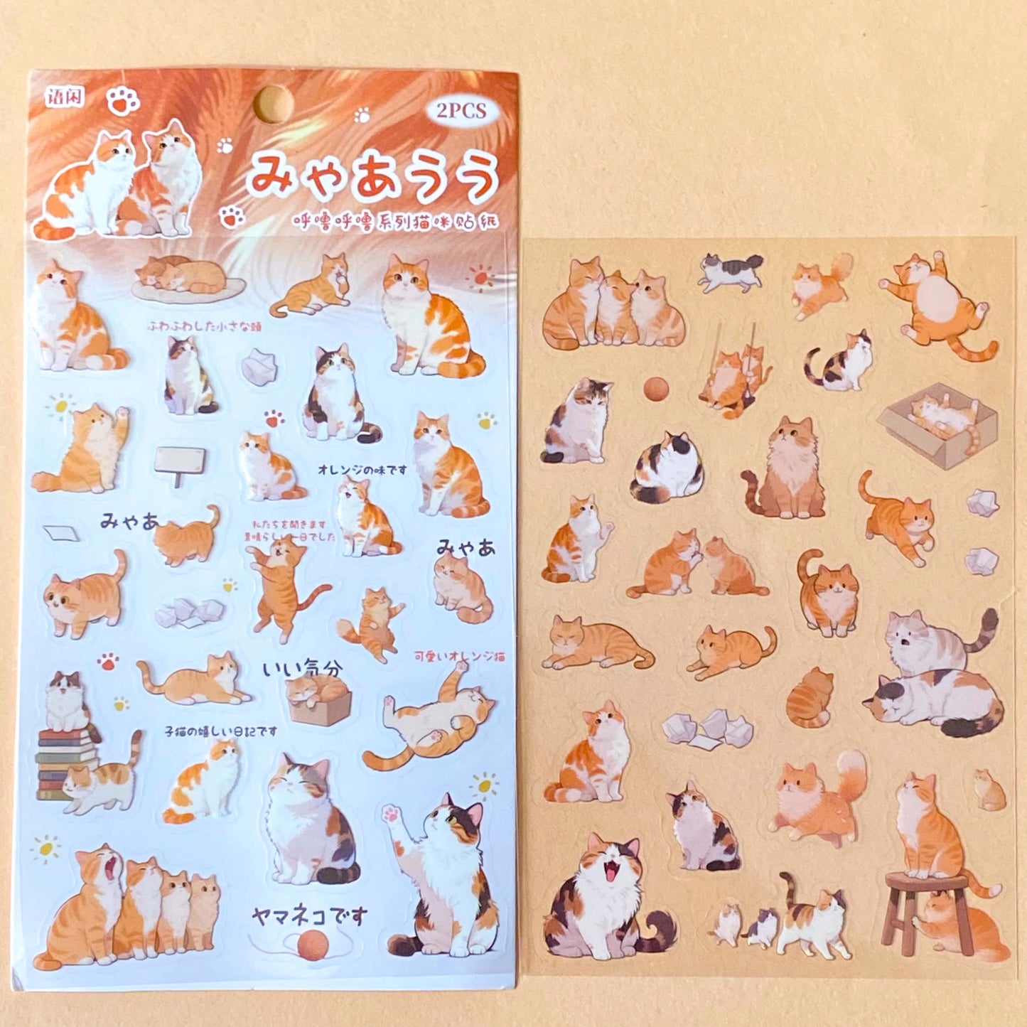 two sheet pack of clear PET stickers of ginger and tortoiseshell cats and fun kittens for fun journaling and planner decoration