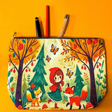 little red riding hood woodland canvas zip pouch featuring foxes, mushrooms and forest trees on a light yellow background. Bright autumn colours of red, orange and yellow. Uk cute gifts shop.