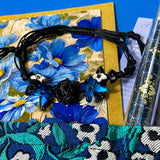 midnight petals letterbox gift set featuring a dark blue and green floral tapestry pouch, botanical ballpoint pen, blank flower greetings card and envelope, floral crystal and butterfly bracelet and dark floral clear sticker pack. uk cute and beautiful gift shop.