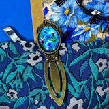 midnight petals letterbox gift set featuring a dark blue and green floral tapestry pouch, botanical ballpoint pen, blank flower greetings card and envelope, floral crystal and butterfly bracelet and dark floral clear sticker pack. uk cute and beautiful gift shop.