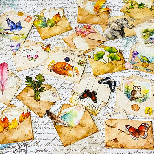 vintage die cuts of antique envelopes and letters with butterflies, animals, birds, leaves and feather decorations in sepia tone for journaling and scrapbooking