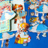 large nutcracker- inspired clear PET sticker pack featuring ballet princess illustrations, toy soldiers, ribbons, clocks and ornate storybook artwork in blue and gold tones with red.