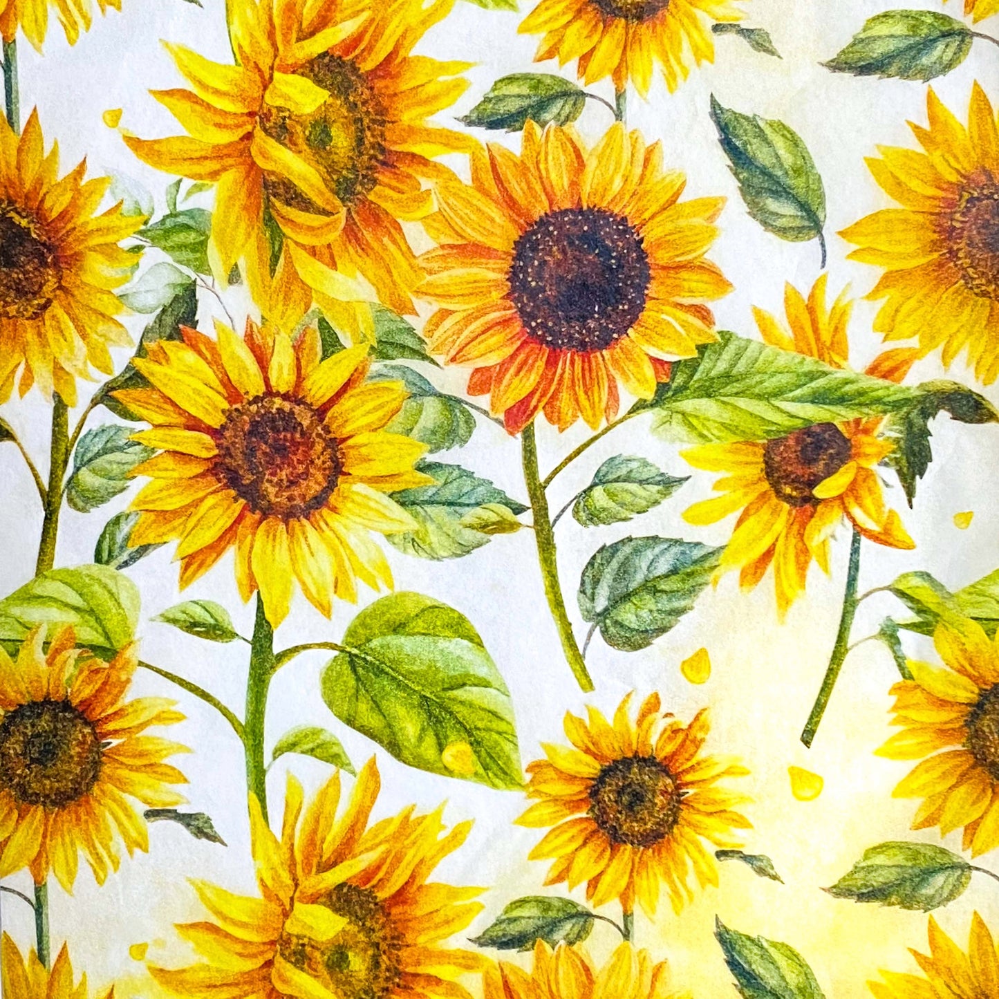 pack of 3 sheets sunflower tissue paper with orange and yellow flowers and green leaves. uk gift packaging supplies and wrap.
