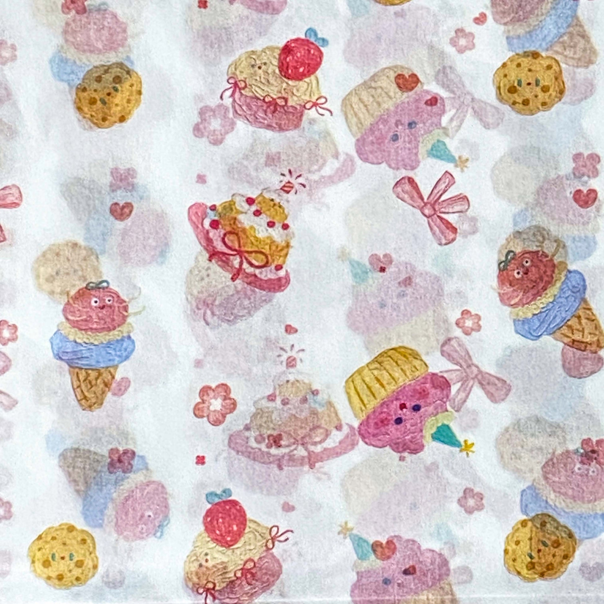 pastel tissue paper with a cute bows, cakes and ice creams pattern on white