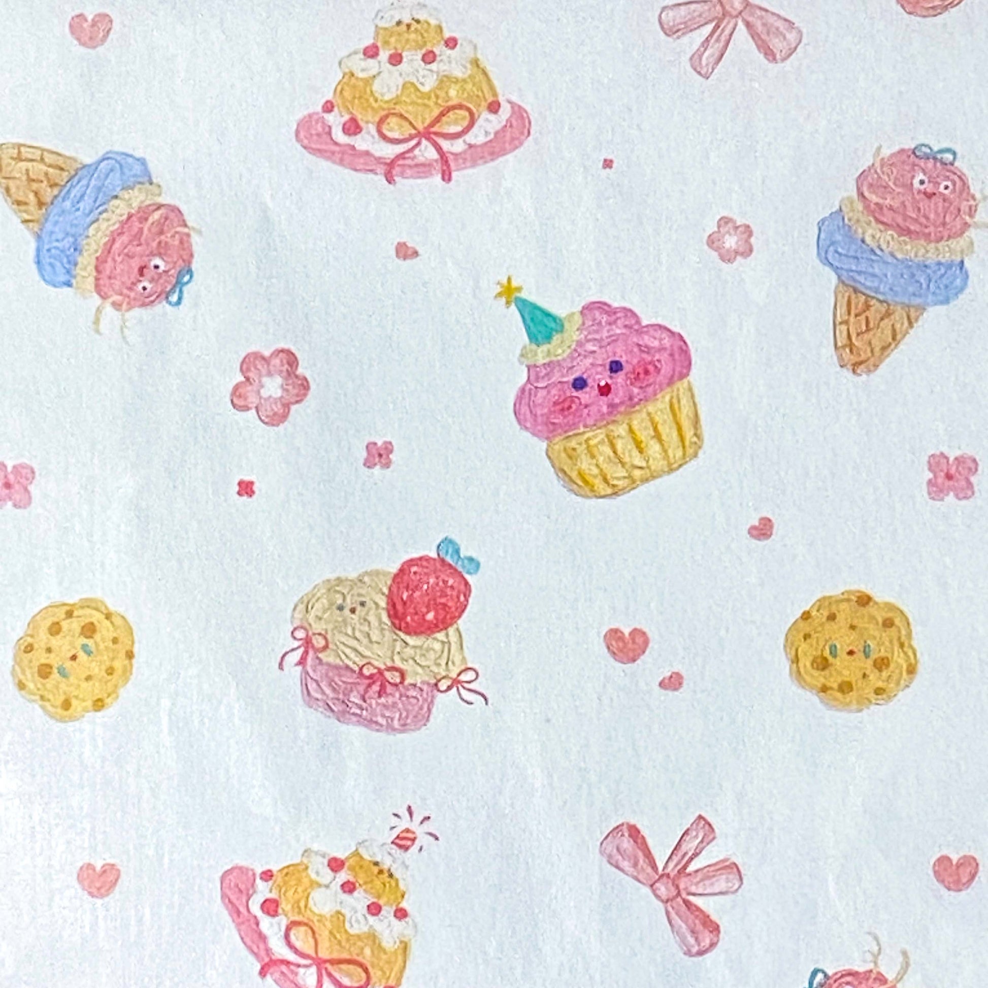 tissue paper sheets with a pastel cakes and bows pattern on white