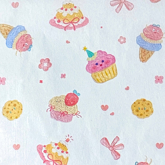 tissue paper sheets with a pastel cakes and bows pattern on white