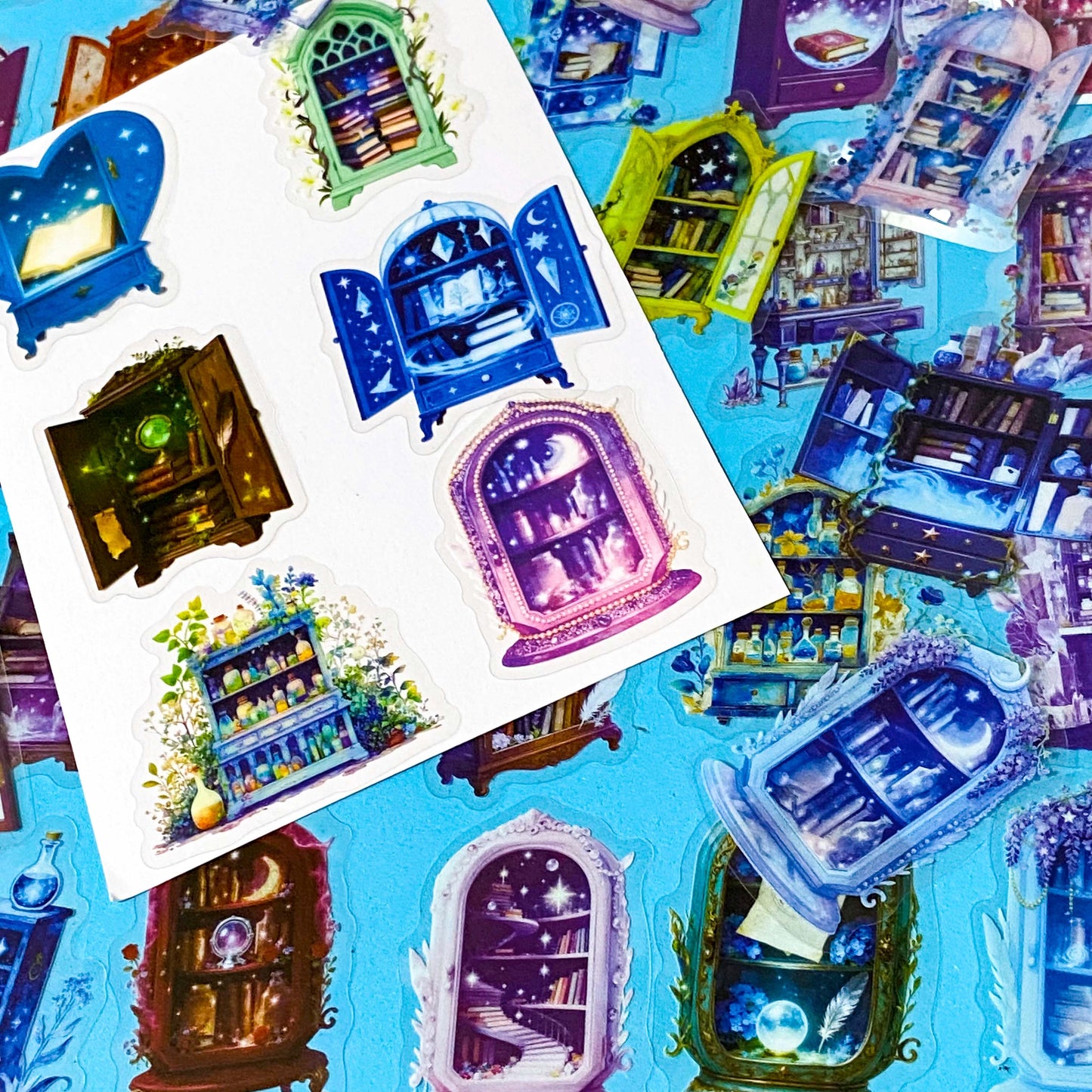 fantasy plastic sticker set featuring magical cabinets, glowing bookshelves, potion cupboards and celestial library illustrations in blue, brown, purple and green tones. UK cute stationery, sticker shop.