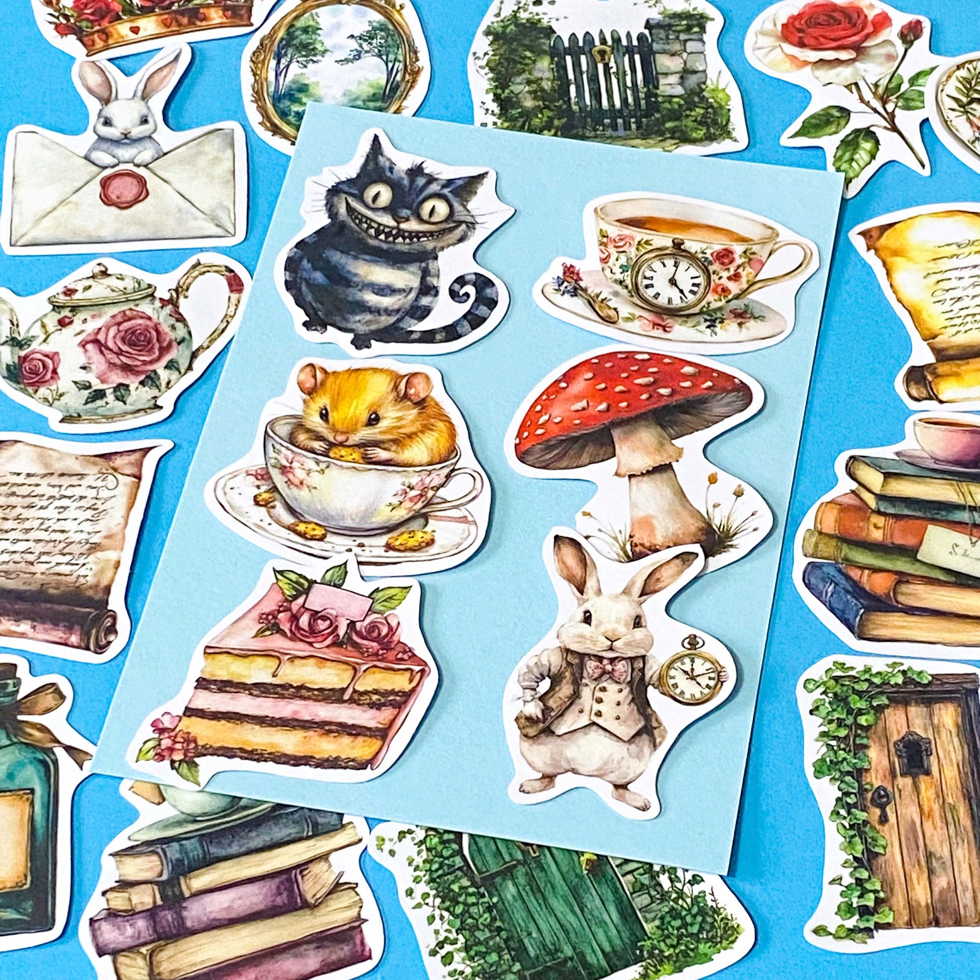 alice in wonderland inspired matte vinyl sticker pack of 20 featuring rabbits, tea cups, dormouse, books, mushroom, potion bottle, whiite rabbit and cheshire cat. uk cute stationery shop and planner supplies.