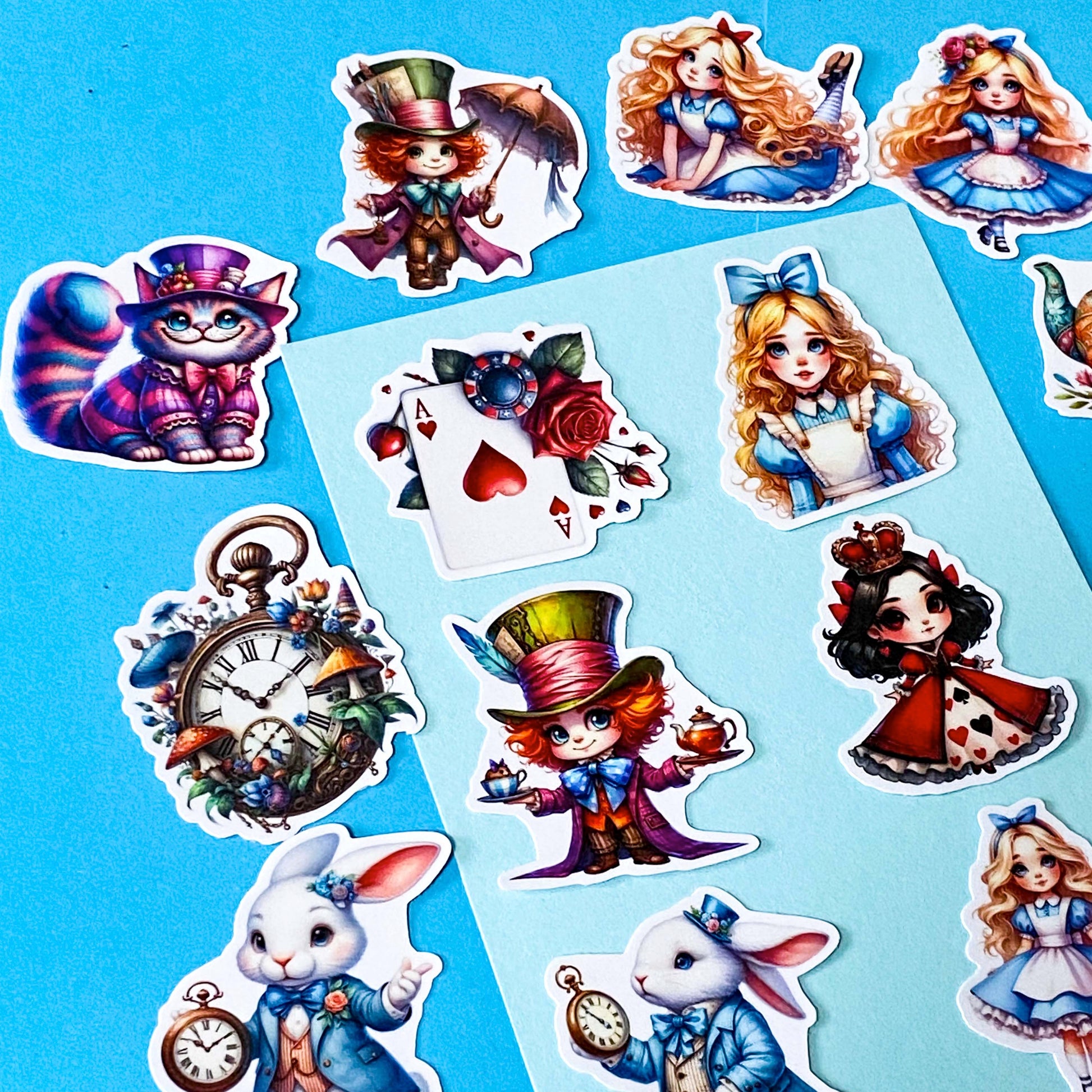 alice in wonderland inspired vinyl satin sticker set of 20 with cute kawaii illustrations featuring mad hatter, cartoon style red queen of hearts, pocket watch, white rabbit, cheshire cat, alice and playing card designs. UK cute stationery and sticker shop.