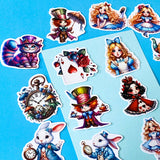 alice in wonderland inspired vinyl satin sticker set of 20 with cute kawaii illustrations featuring mad hatter, cartoon style red queen of hearts, pocket watch, white rabbit, cheshire cat, alice and playing card designs. UK cute stationery and sticker shop.