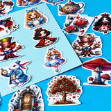 alice in wonderland inspired vinyl satin sticker set of 20 with cute kawaii illustrations featuring mad hatter, cartoon style red queen of hearts, pocket watch, white rabbit, cheshire cat, mushrooms, red roses, alice and playing card designs. UK cute stationery and sticker shop.
