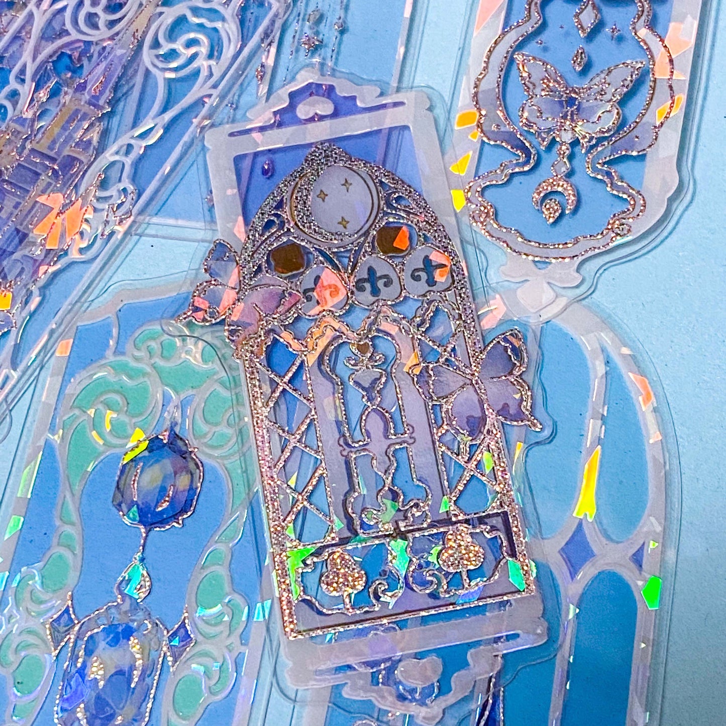 holographic blue window plastic bookmarks with butterflies and princess castles on a blue background