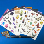 set of 8 witch themed sticker sheets including dark academia, botanical, celestial and magical designs on a blue background