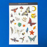 sheet of dark academia witchy stickers on a dark blue background