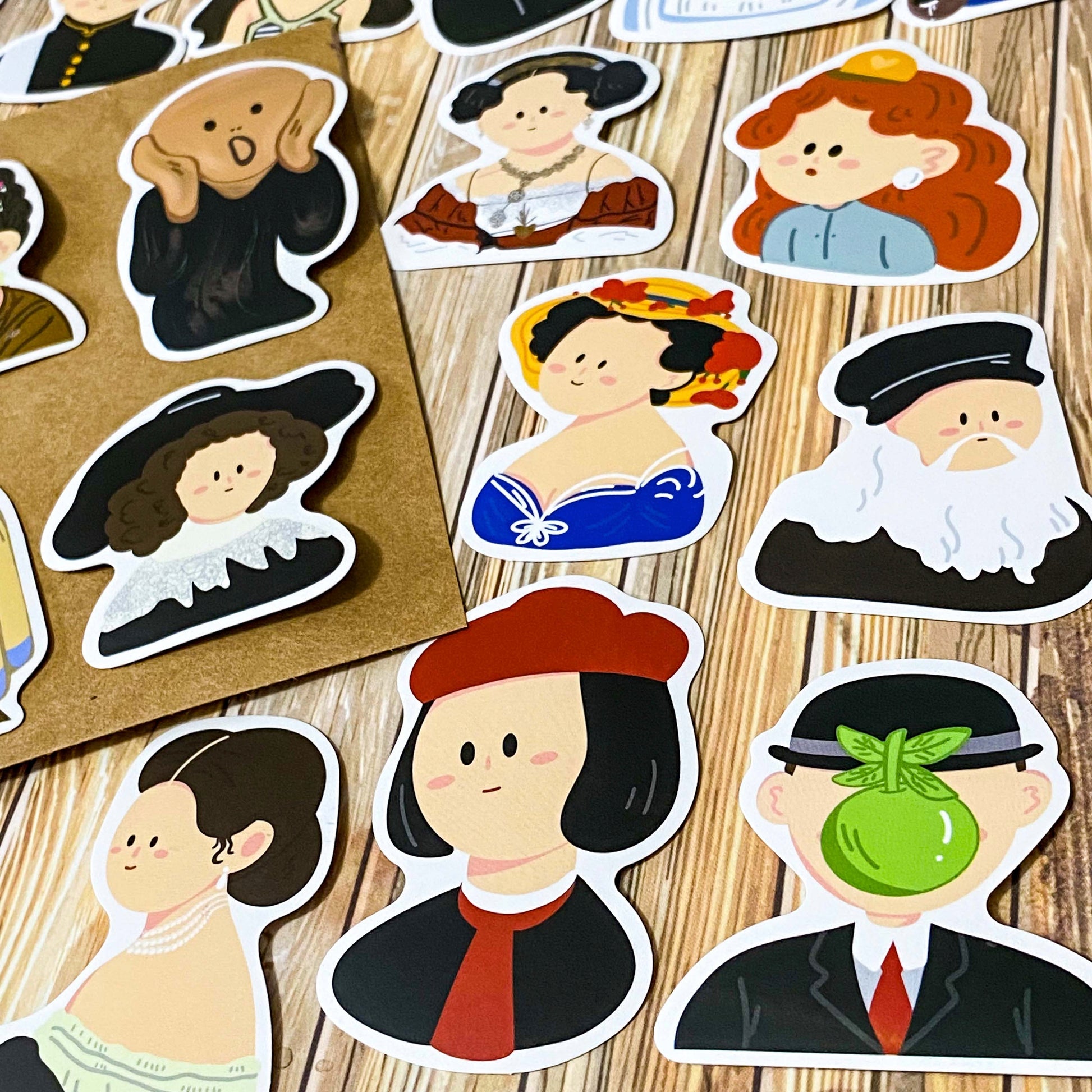 fifty different kawaii portrait art stickers inspired by famous artists, masterpieces and historical figures with matte finish, each measuring up to 70mm tall. designs include mona lisa, the scream, birth of venus, frieda kahlo, matisse, van gogh