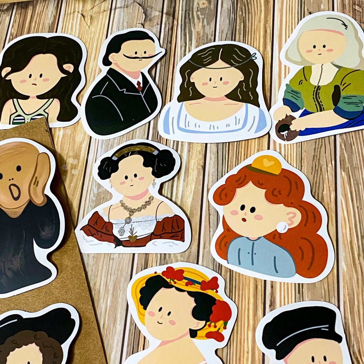 fifty different kawaii portrait art stickers inspired by famous artists, masterpieces and historical figures with matte finish, each measuring up to 70mm tall. designs include mona lisa, the scream, birth of venus, frieda kahlo, matisse, van gogh