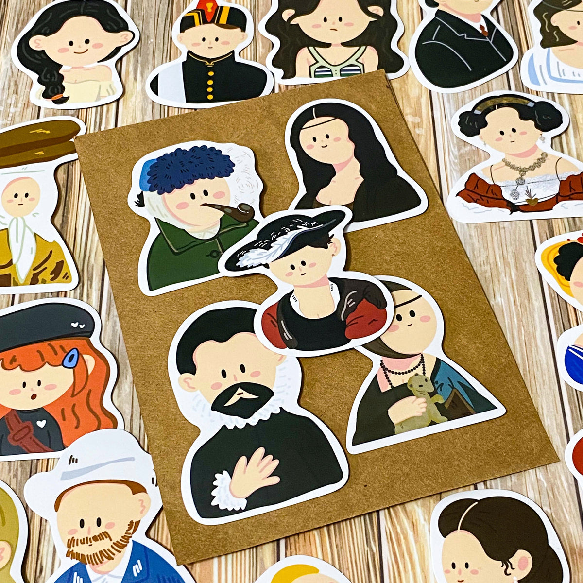 fifty different kawaii portrait art stickers inspired by famous artists, masterpieces and historical figures with matte finish, each measuring up to 70mm tall. designs include mona lisa, the scream, birth of venus, frieda kahlo, matisse, van gogh