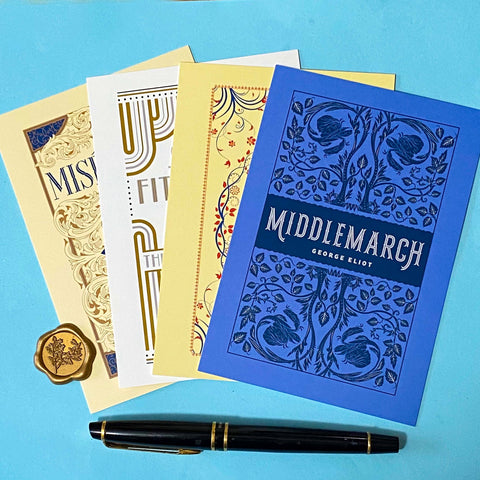 set of 4 vintage literary postcards featuring classic book covers in art deco style on a bleu background