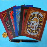 set of 5 vintage literary postcards featuring gothic book covers including dracula, sherlock holmes and edgar allan poe on a blue background