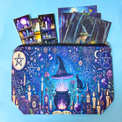 witchy canvas pouch with magical illustration filled with fantasy postcards and bookmarks on blue background