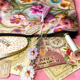 vintage floral letterbox gift set with large flower pouch, pearly white metal pen, daisy tassel acrylic bookmark, floral postcards and vintage decorative journaling stickers on pink background. UK cute gifts and stationery sets.