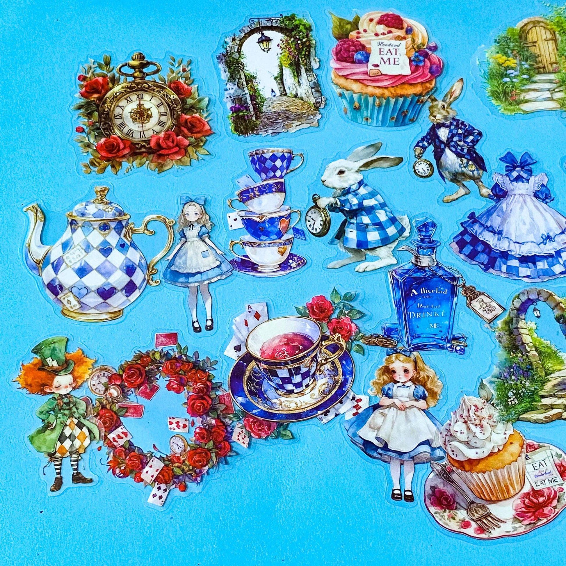wonderland themed pack of 40 clear PET stickers with Alice illustrations, white rabbits, potion bottles, cupcakes, tea party, teacup, teapot, mad hatter, roses and pocket watches. Uk cute kawaii stationery shop.
	