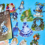 wonderland themed pack of 40 clear PET stickers with Alice illustrations, white rabbits, potion bottles, cupcakes, tea party, teacup, teapot, mad hatter, roses and pocket watches. Uk cute kawaii stationery shop.