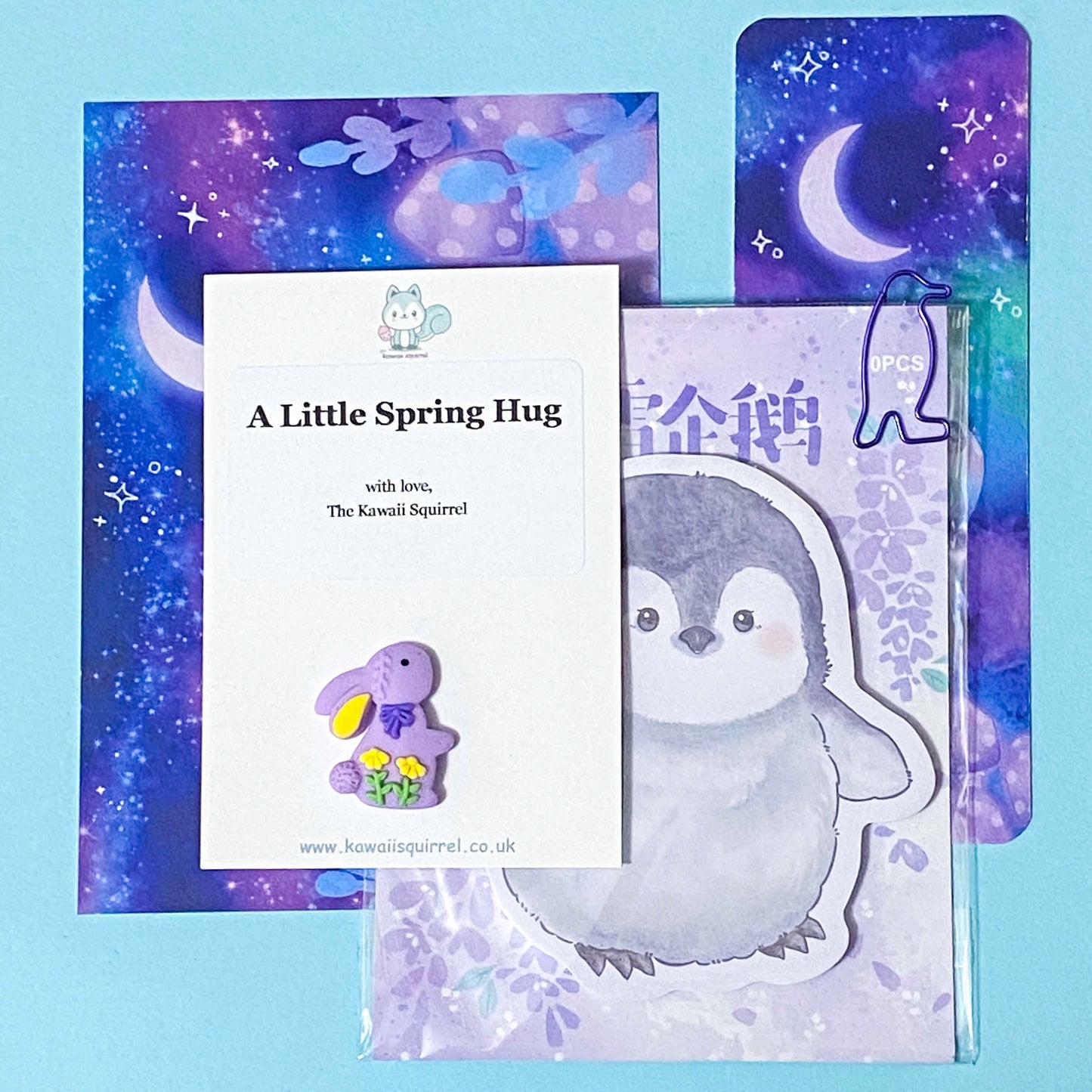 penguin themed spring happy post gift pack with a memo, a handmade postcard, a bookmark, a bunny pocket hug and a paper clip