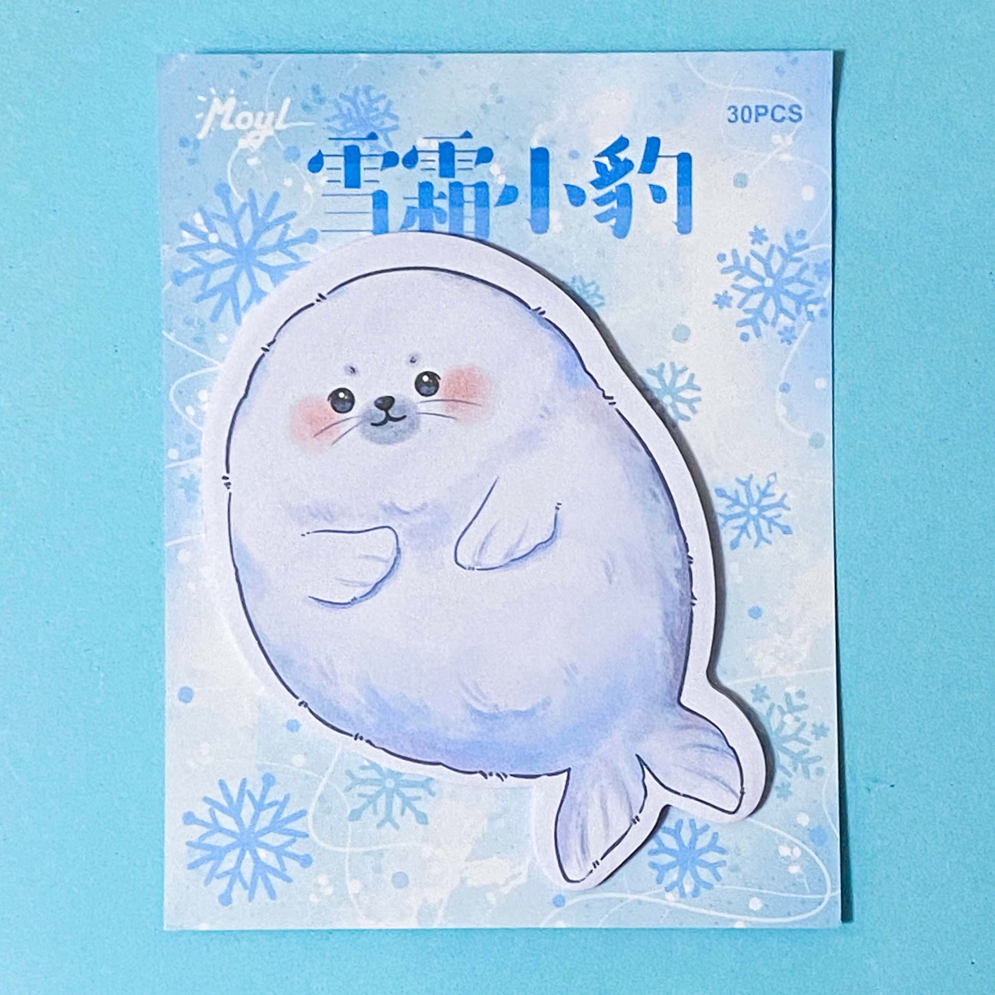 blue seal sticky memo notes pad on a blue background