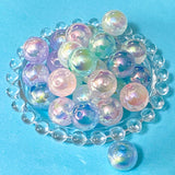16mm acrylic aurora marble beads with a pastel glaze on a blue background