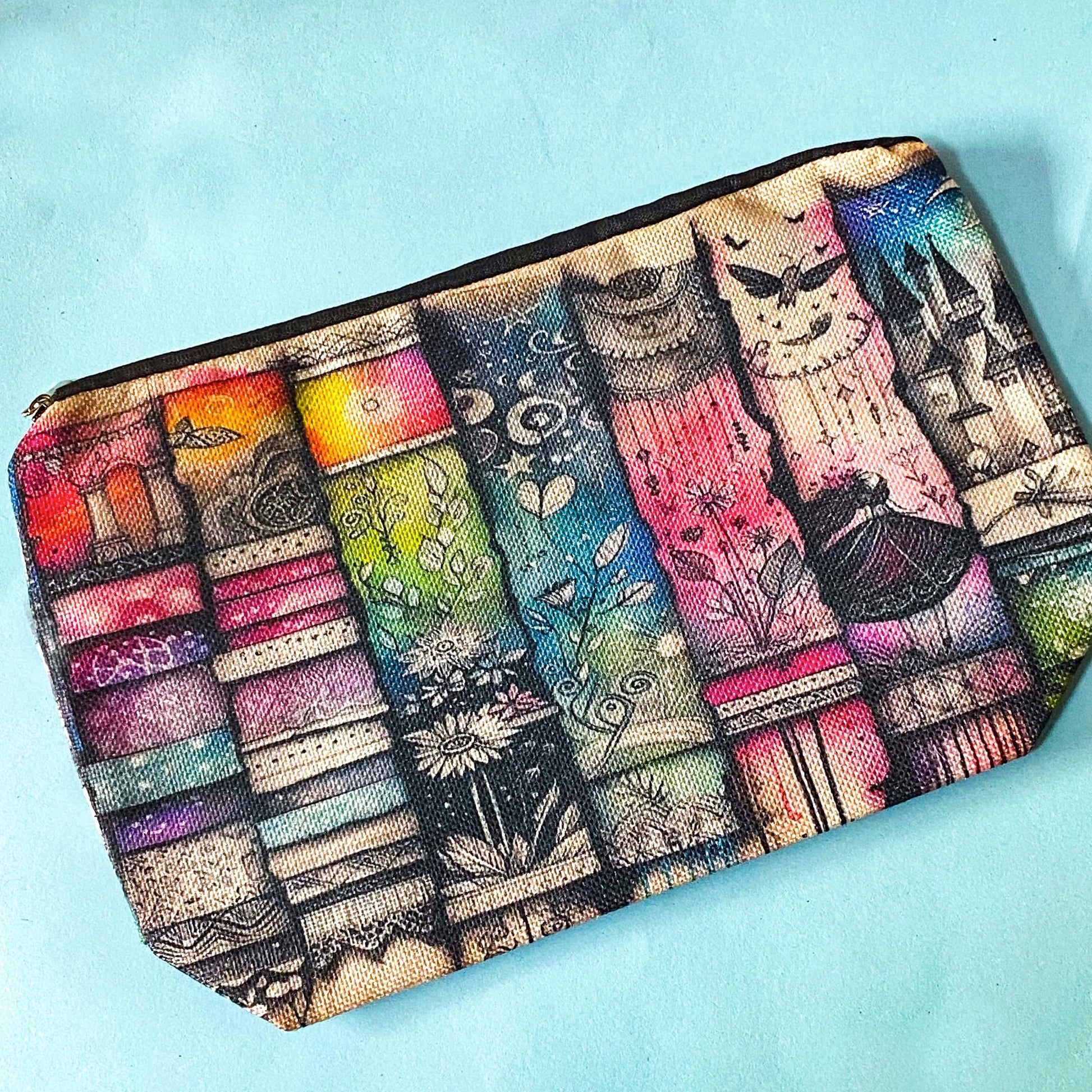fairytale bookshelf fantasy canvas pouch with magical theme on a blue background