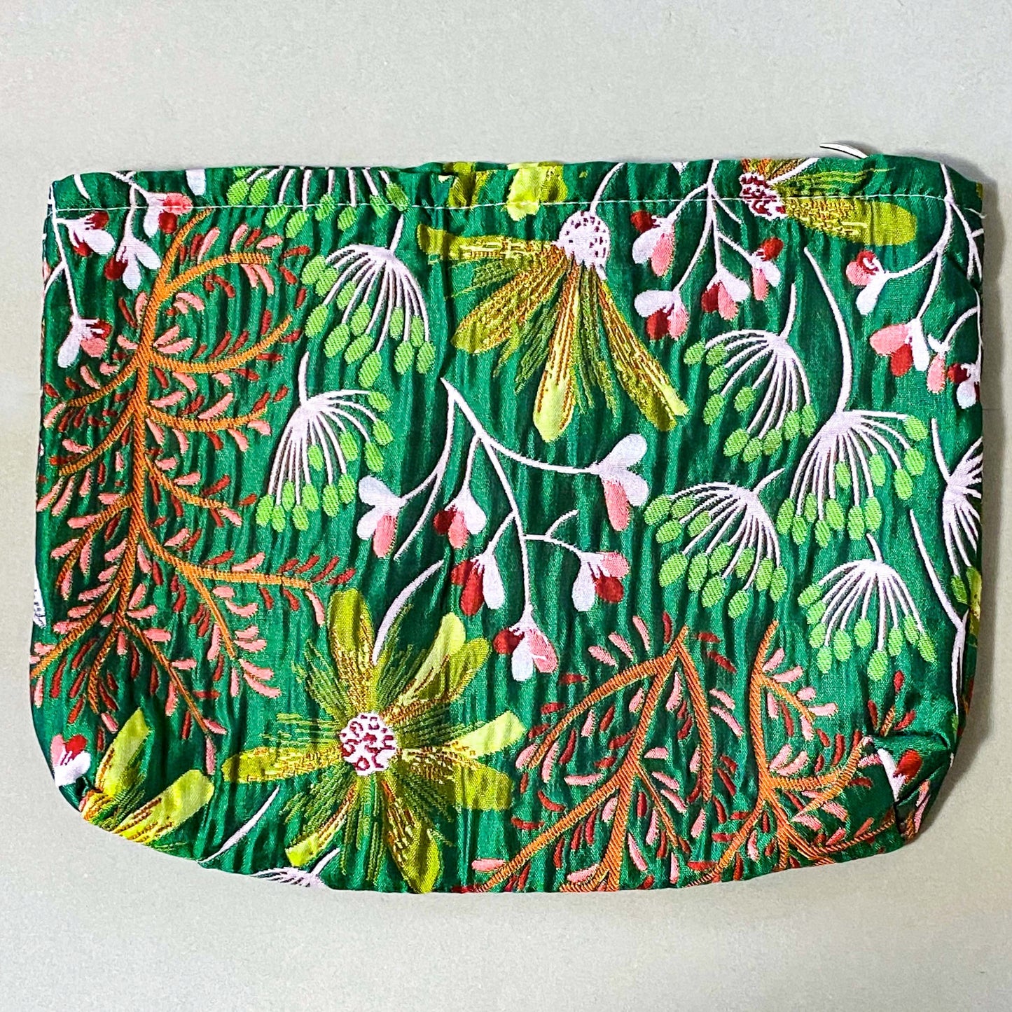 emerald conservatory tapestry pouch featuring a woven satin botanical design in emerald green, coral pink and cream with concealed zip fastening and cream lined interior. Uk luxury letterbox gifts shop. 